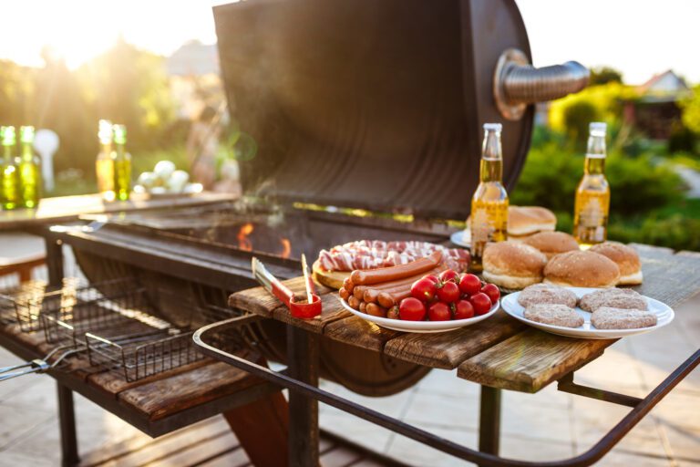 Barbecue grill party. Tasty food on wooden desk. Copy space.